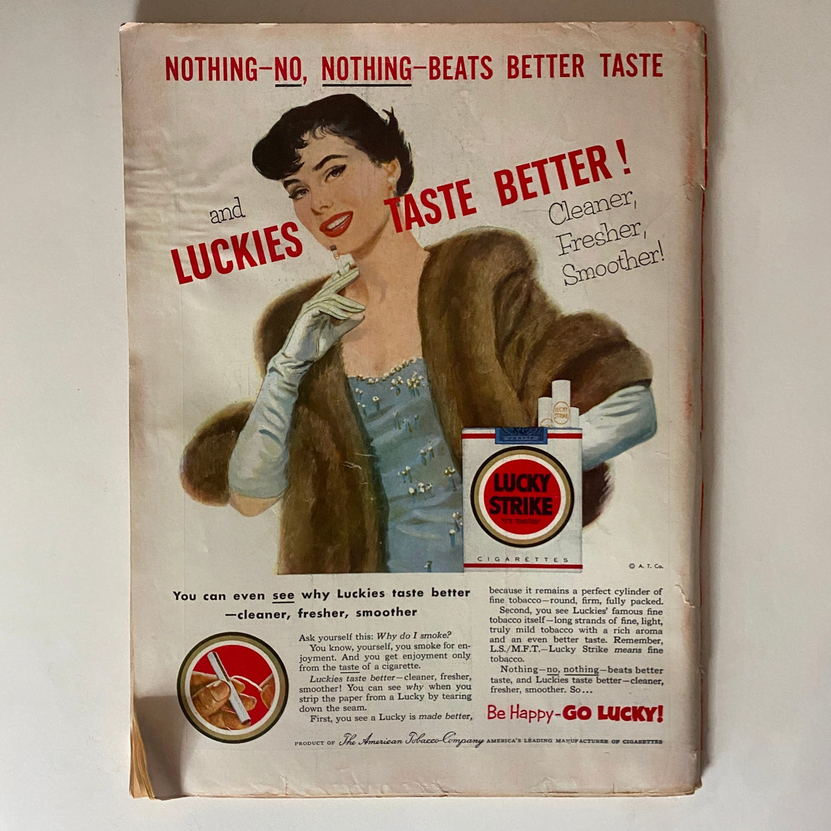Advert for Lucky Strike cigarettes on the back cover of VTG Time Magazine March 9, 1953, featuring a woman in glamorous attire promoting the brand.