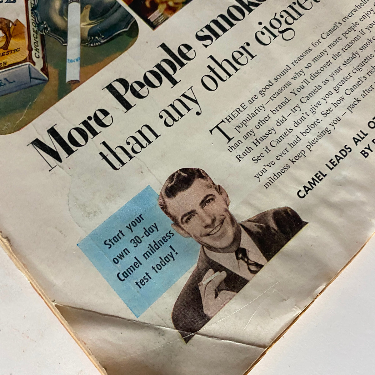 Vintage advertisement from Time Magazine October 20, 1952, featuring a smiling man promoting Camel cigarettes, emphasizing the brand's popularity and inviting readers to start a Camel mildness test.