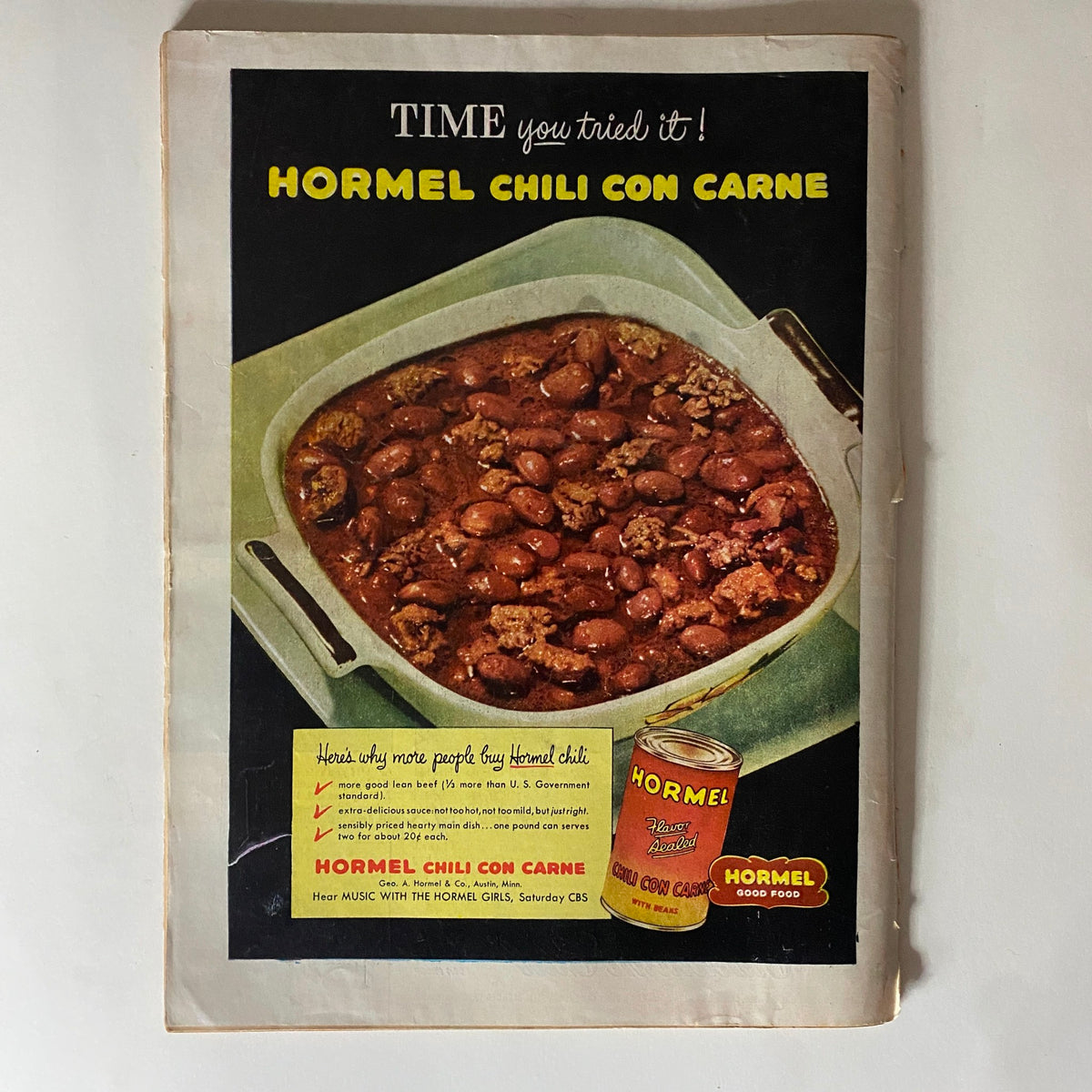 Vintage advertisement for Hormel Chili Con Carne from the VTG Time Magazine dated October 13, 1952, showcasing a bowl of chili with beans and a can of Hormel chili, emphasizing its popularity and good food quality.