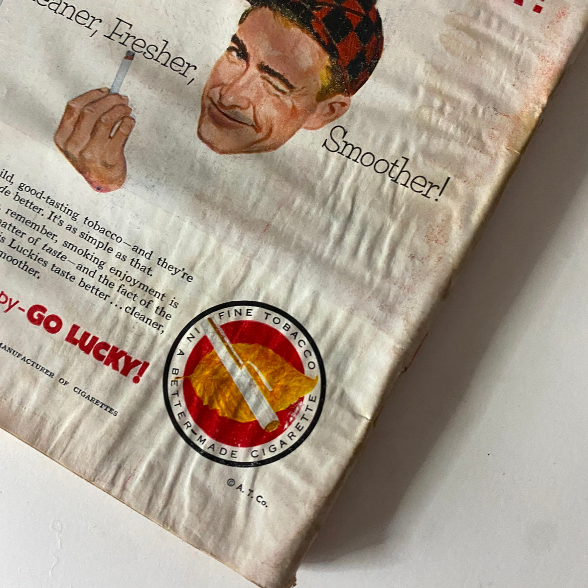 Vintage advertisement from the November 9, 1953 issue of Time Magazine featuring a smiling man holding a cigarette and promoting Lucky Strike cigarettes, highlighting slogans like 'Cleaner, Fresher, Smoother!' with the iconic 'Go Lucky!' call to action.
