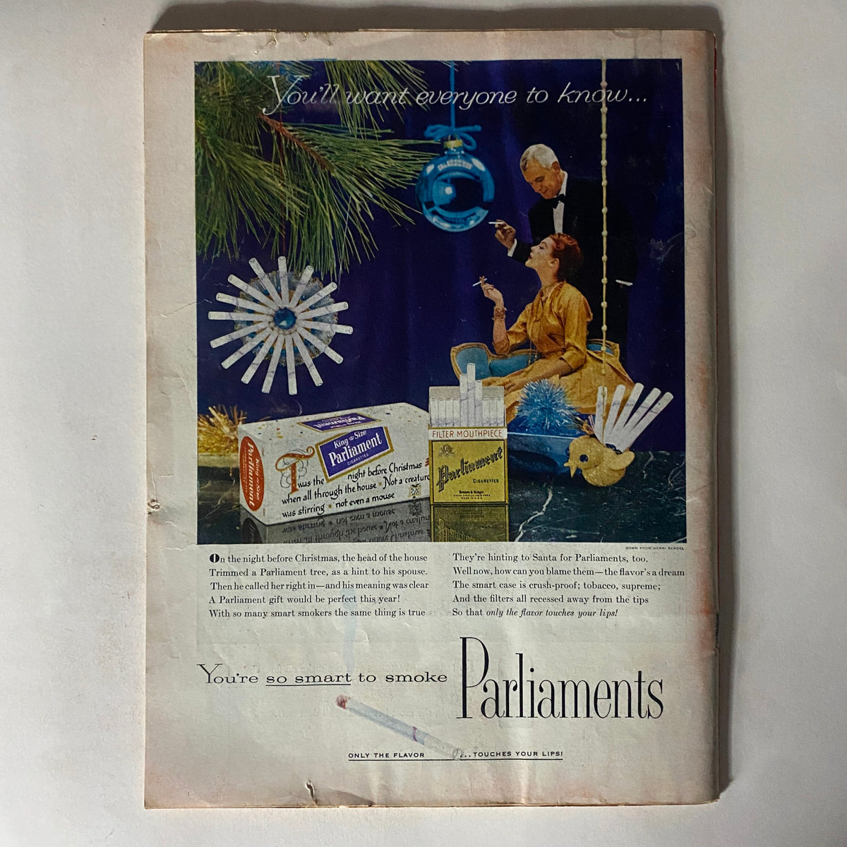 Vintage advertisement from VTG Time Magazine December 19, 1955, promoting Parliament cigarettes with a festive theme, showcasing a holiday scene and elegant design.