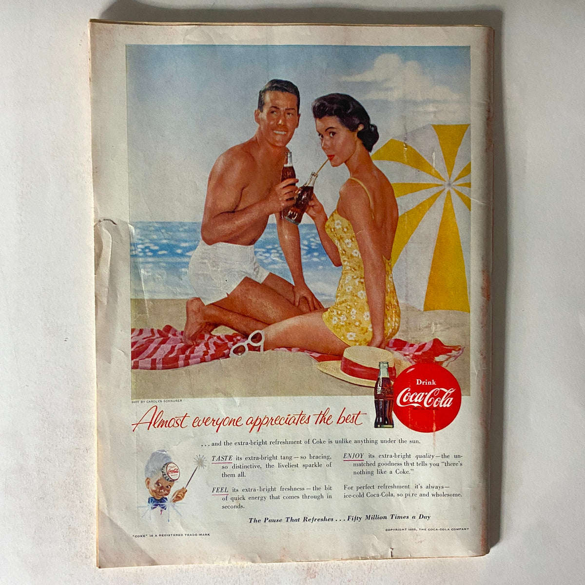 Advertisement page from Vintage Time Magazine August 8, 1955, featuring a couple enjoying Coca-Cola on a beach, emphasizing refreshing summer moments, Vol 66 No. 6.