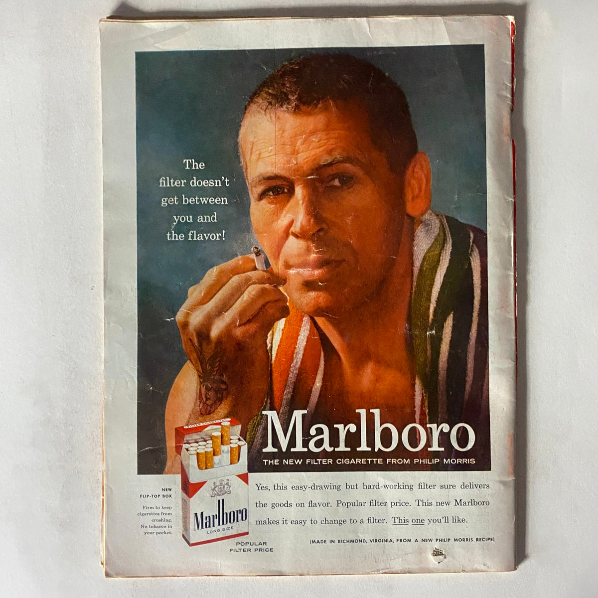 Vintage Time Magazine August 1, 1955 featuring a Marlboro cigarette advertisement showcasing a man holding a cigarette, emphasizing its flavor and new filtering technology.