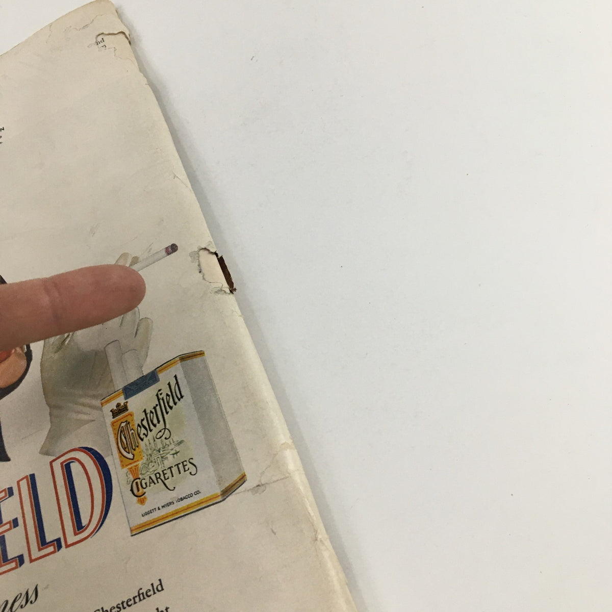 Detail shot of Time Magazine June 24, 1940 cover showing Chesterfield cigarette branding, with a hand pointing at the advertisement, emphasizing the magazine's collectible value and vintage charm.