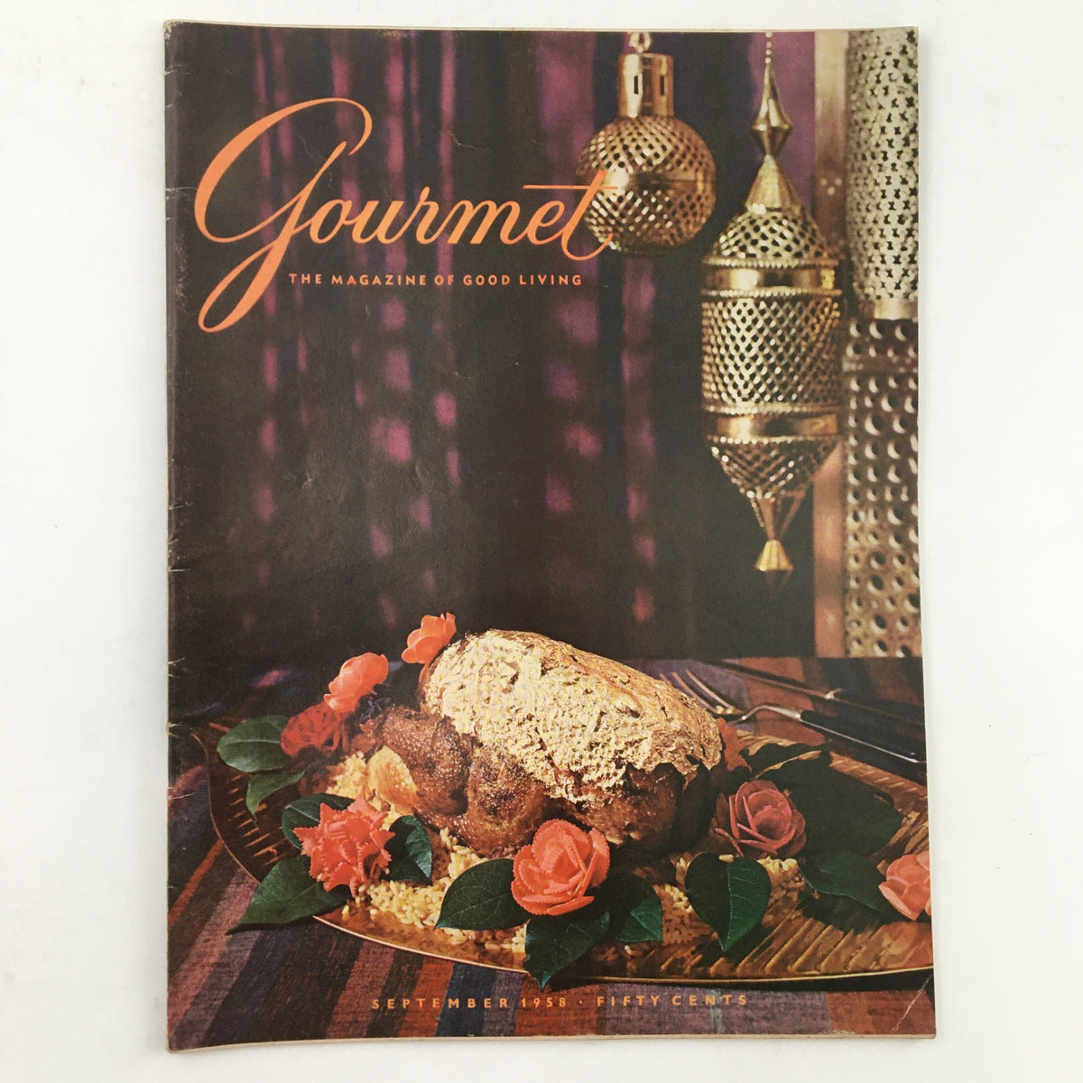 Cover of Gourmet Magazine September 1958 describing culinary trends, featuring a loaf of bread, roses, and ornate decor, showcasing Volume 18, Number 9.