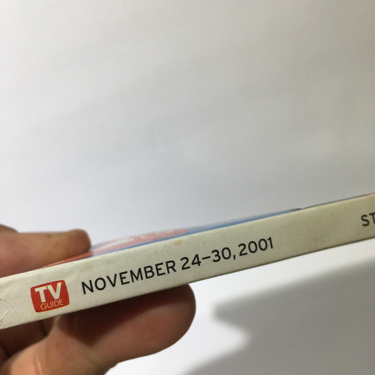 Side view of the TV Guide Nov 24-30 2001, highlighting publication date and logo.