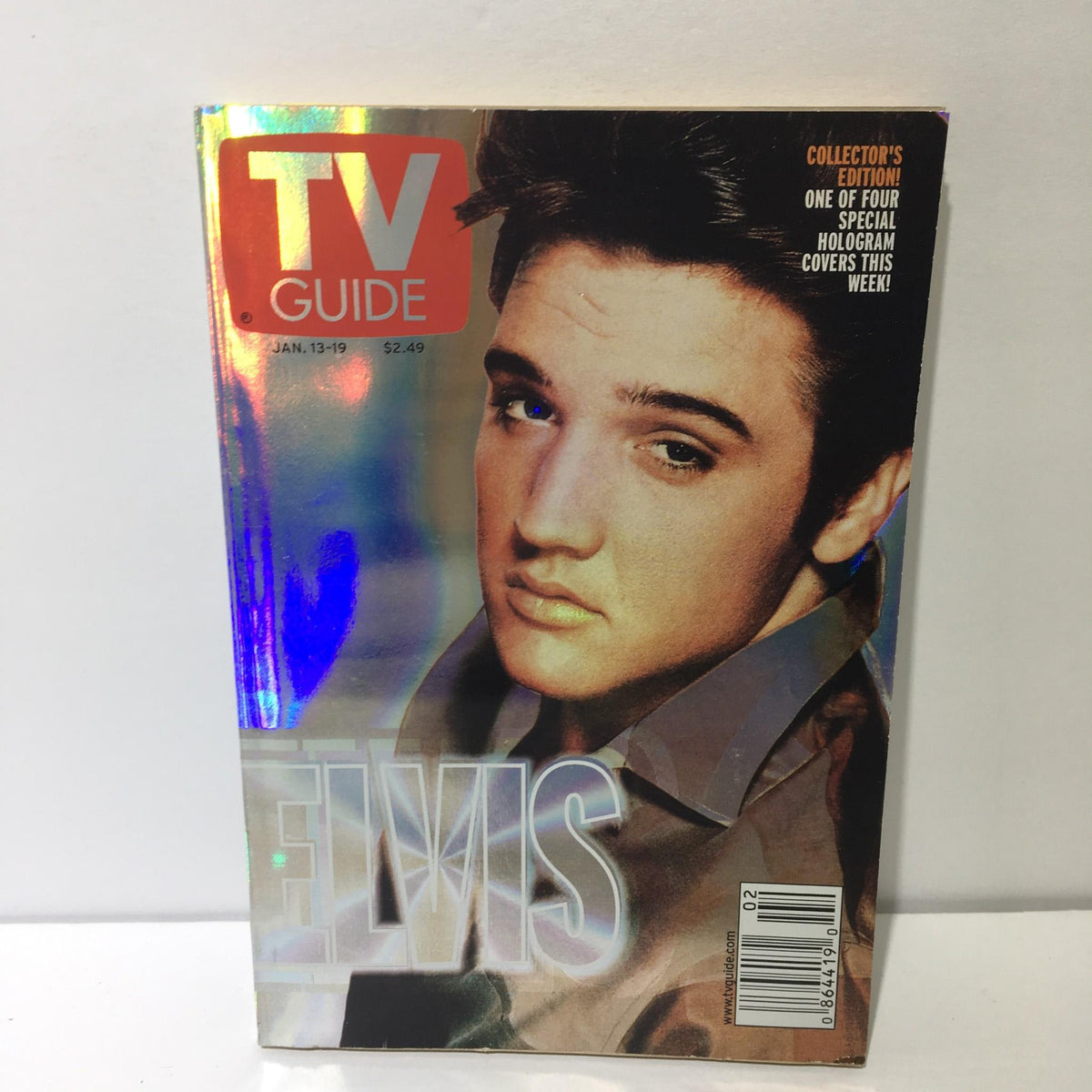 TV Guide January 13-19 2001 featuring Elvis Presley on the cover in holographic design, showcasing the iconic star's image.