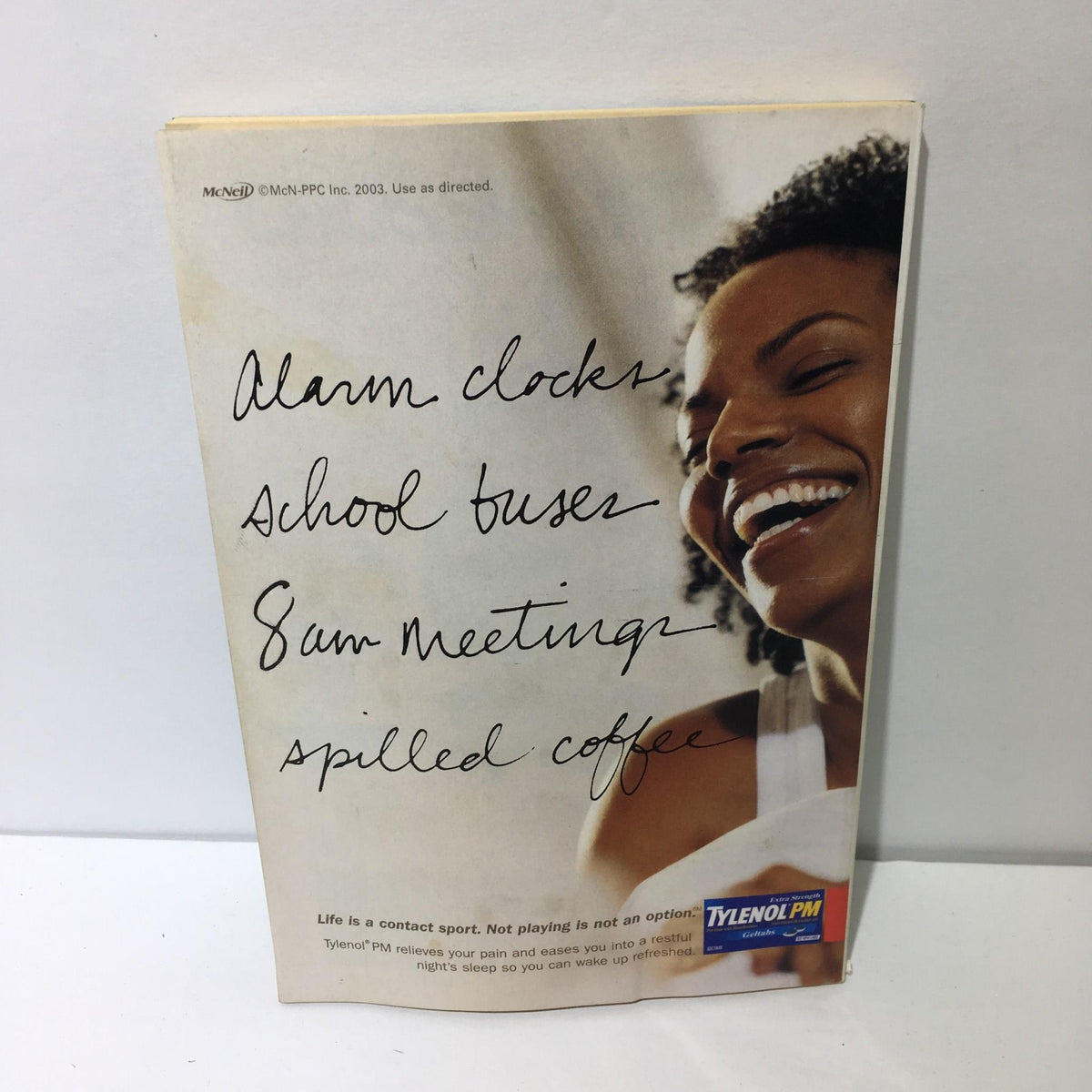 Cover of TV Guide June 21-27 2003 featuring a promotional advertisement for Tylenol PM with a smiling woman, displaying the challenges of daily life.
