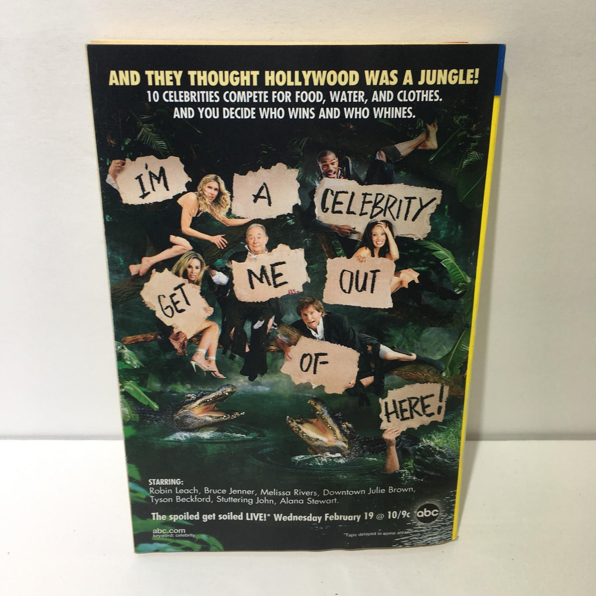 Cover of TV Guide featuring the title 'I'm a Celebrity, Get Me Out of Here!' showcasing a jungle theme with celebrities, highlighting the series premiere airing live on February 19.