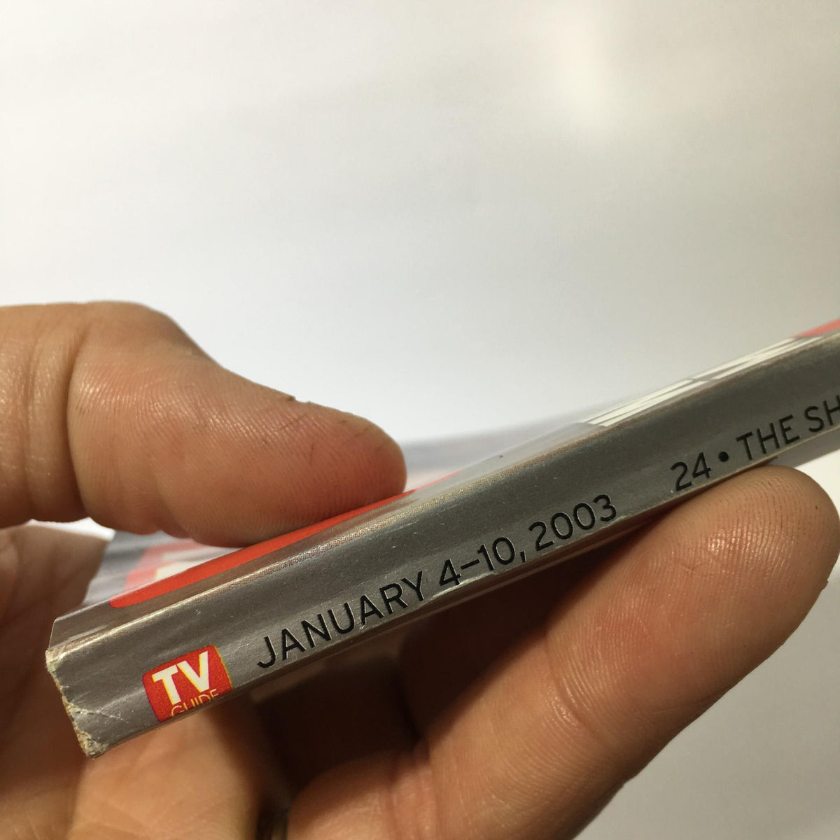 Side view of TV Guide Jan 4-10, 2003 showing the publication date and title details.