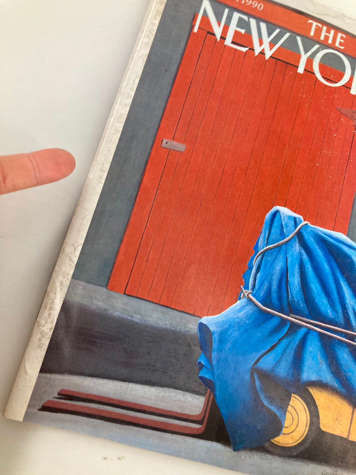 Close-up view of the New Yorker magazine cover from October 8, 1990, depicting the 'Forklift' artwork by Gretchen Dow Simpson, highlighting the red door and blue tarp details.