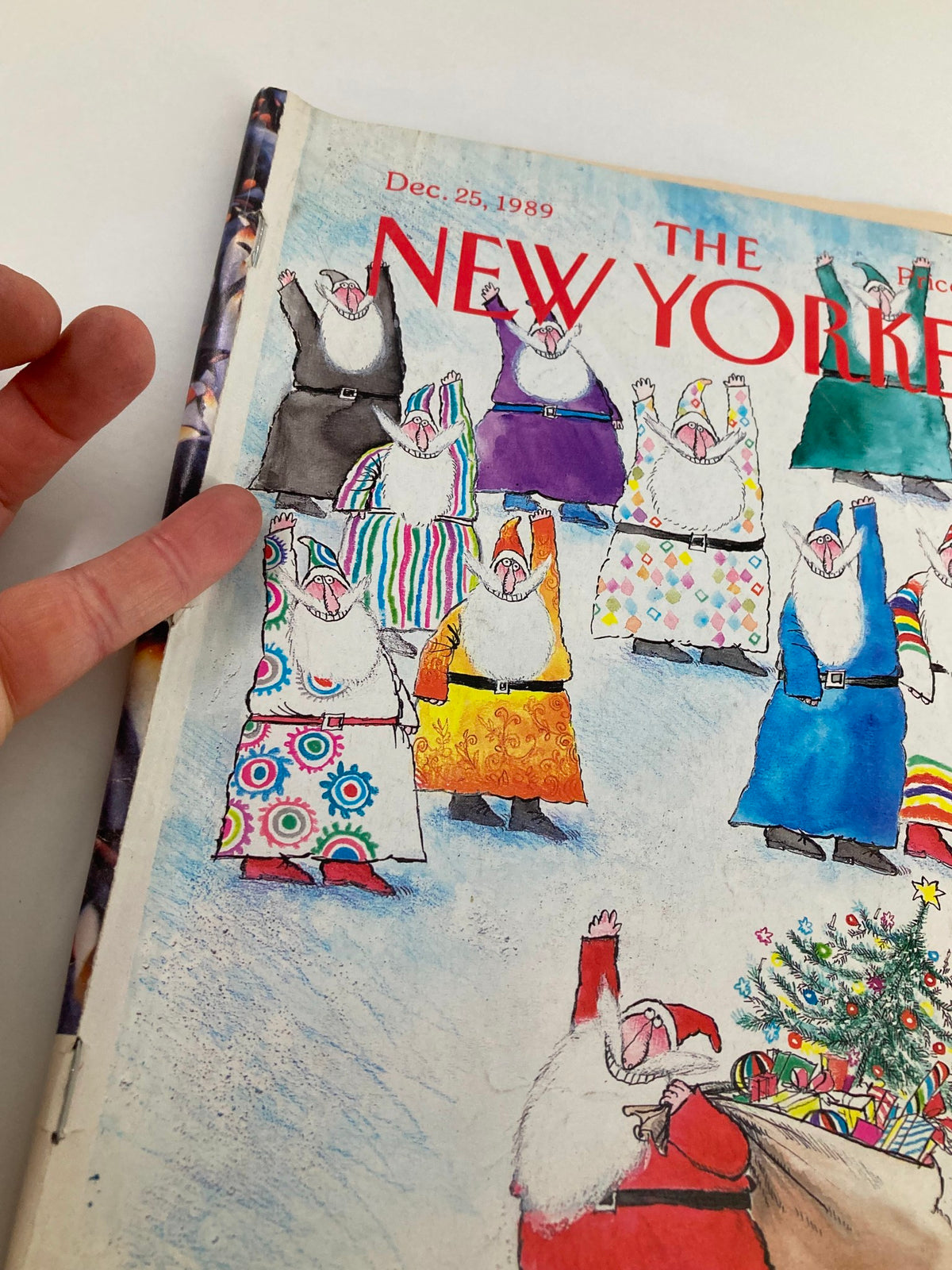 Detail view of the cover of The New Yorker full magazine December 25, 1989 showcasing Santa and vibrant holiday-themed illustrations by Ronald Searle.