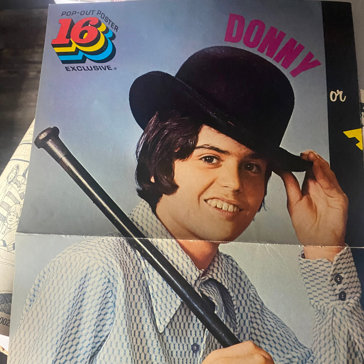 Fold-out poster of a smiling male model wearing a hat from VTG 16 Magazine November 1973, emphasizing the magazine's pop culture appeal.