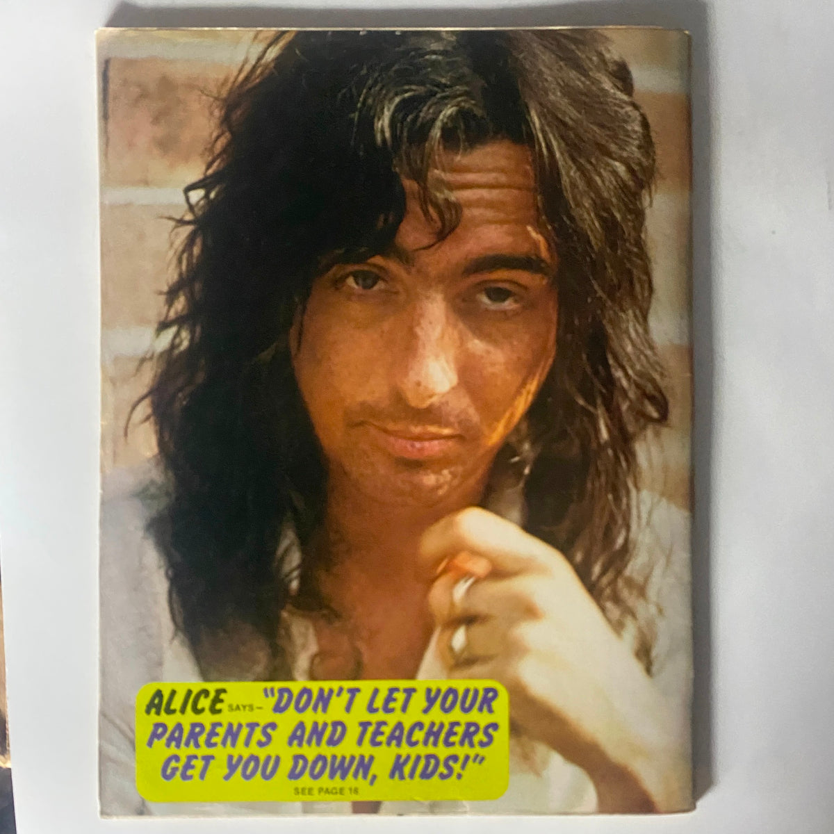 VTG 16 Magazine August 1974 showcasing a close-up image of a rock star with long hair, captioned 'Don't let your parents and teachers get you down, kids!' relating to the cultural vibe of the 1970s.