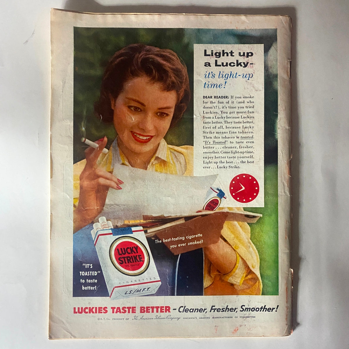 Vintage advertisement from VTG Time Magazine August 22, 1955, for Lucky Strike cigarettes, featuring a woman promoting the product with an emphasis on its taste.