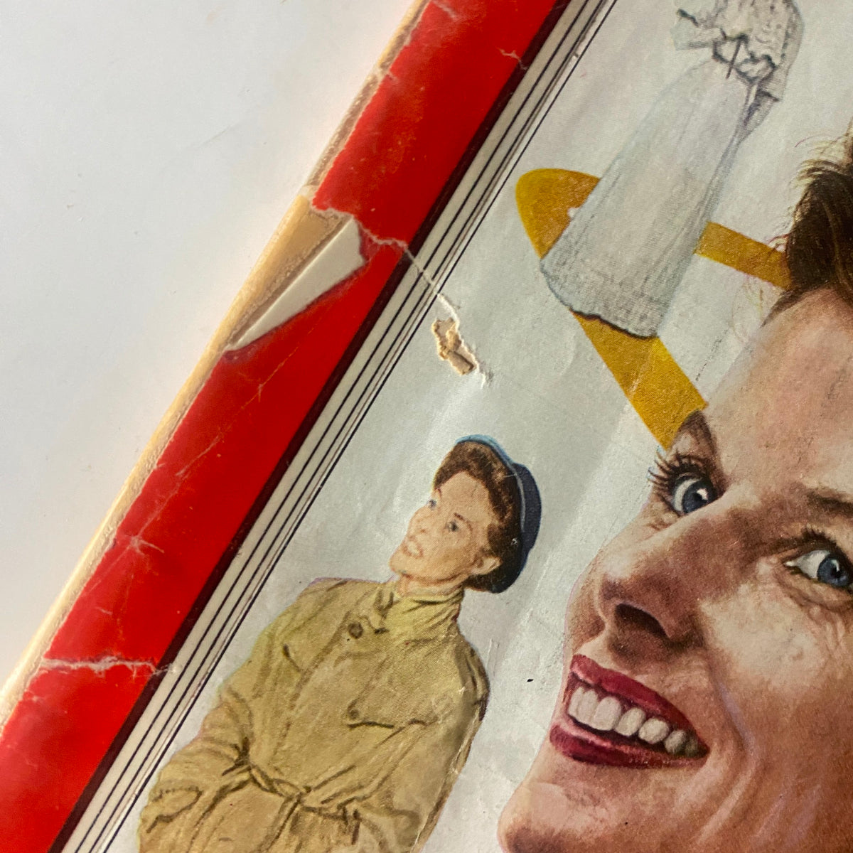 Close-up of the edge of the vintage Time Magazine cover dated September 1, 1952, highlighting detailed illustrations of Katharine Hepburn.