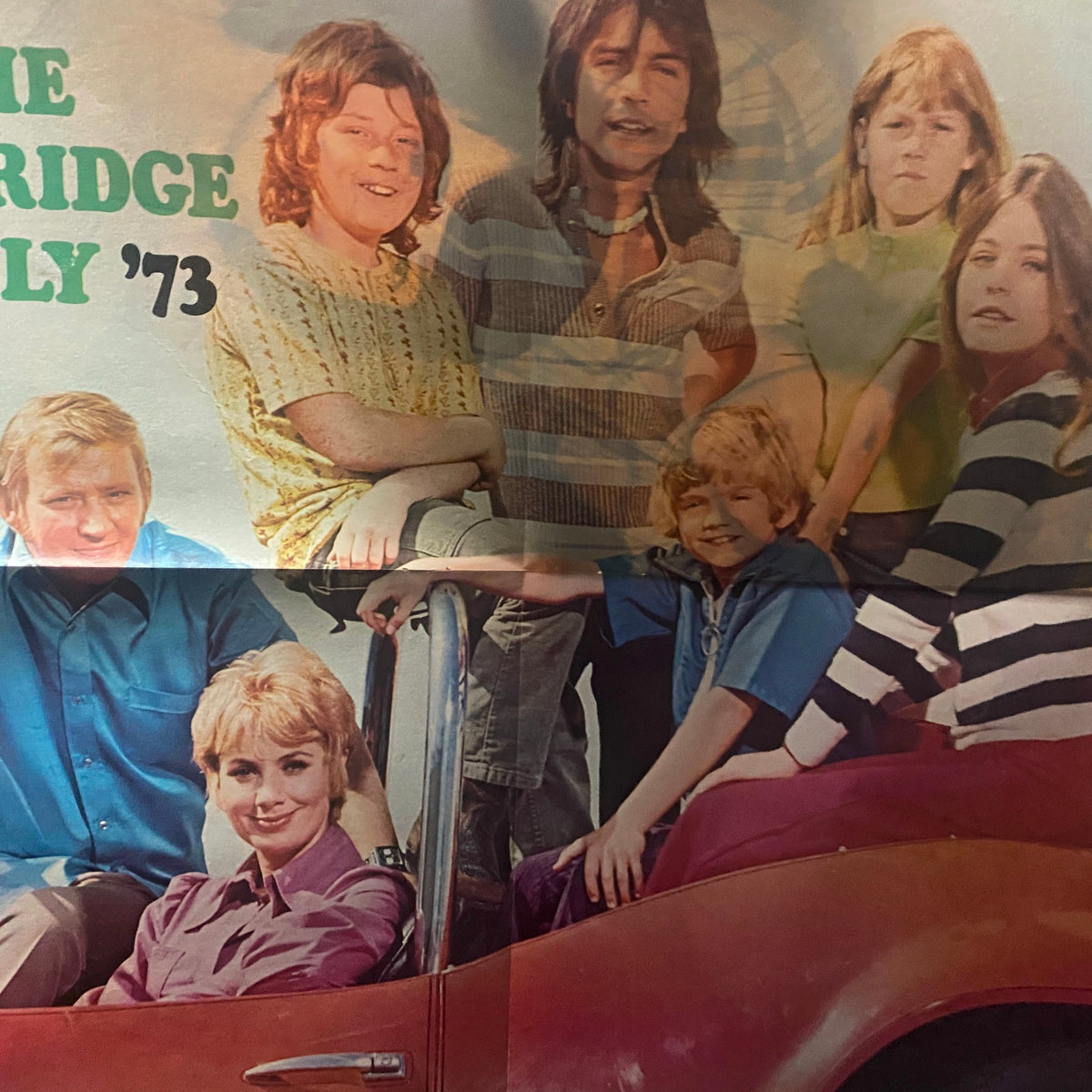 Image of a group of young people including a woman in a convertible, featured in VTG 16 Magazine December 1973, capturing the vibrant youth culture of 1973 in Vol 15 No. 7.