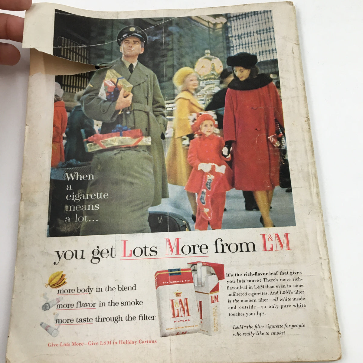 Advertisement page from Sport Magazine December 1962 featuring a vintage cigarette ad, embodying the advertising style of the era.
