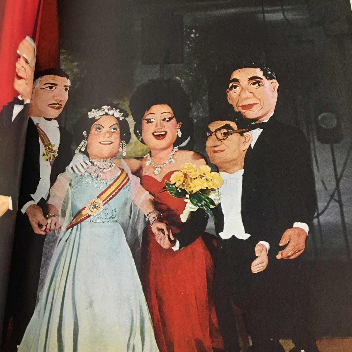 Another interior view of Flair Magazine October 1950 titled 'At Home and On The Town', featuring puppets dressed elegantly in a social gathering.