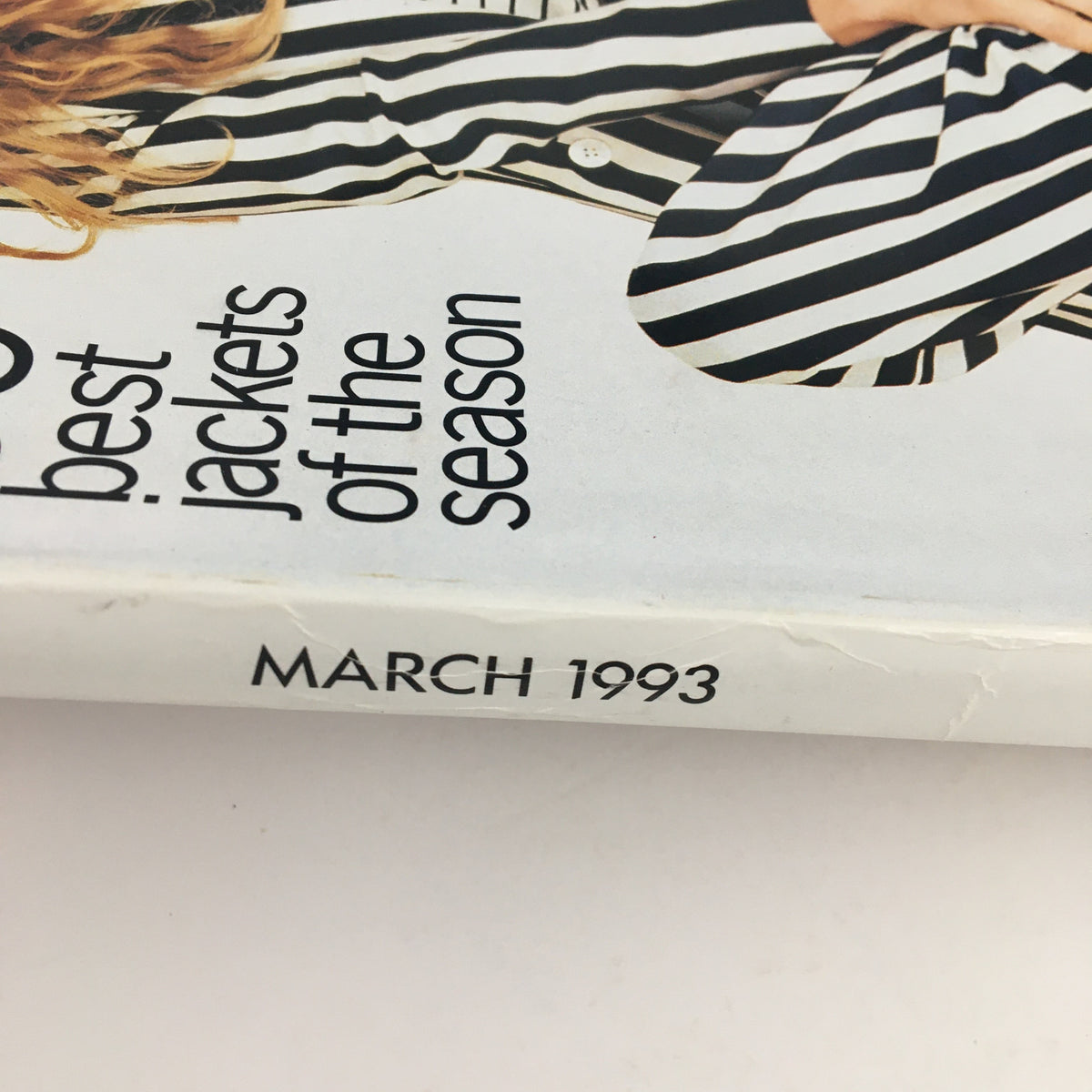 Close-up view of Vogue Magazine March 1993 showcasing the magazine's title and the date, emphasizing its collectible nature and fashion content.