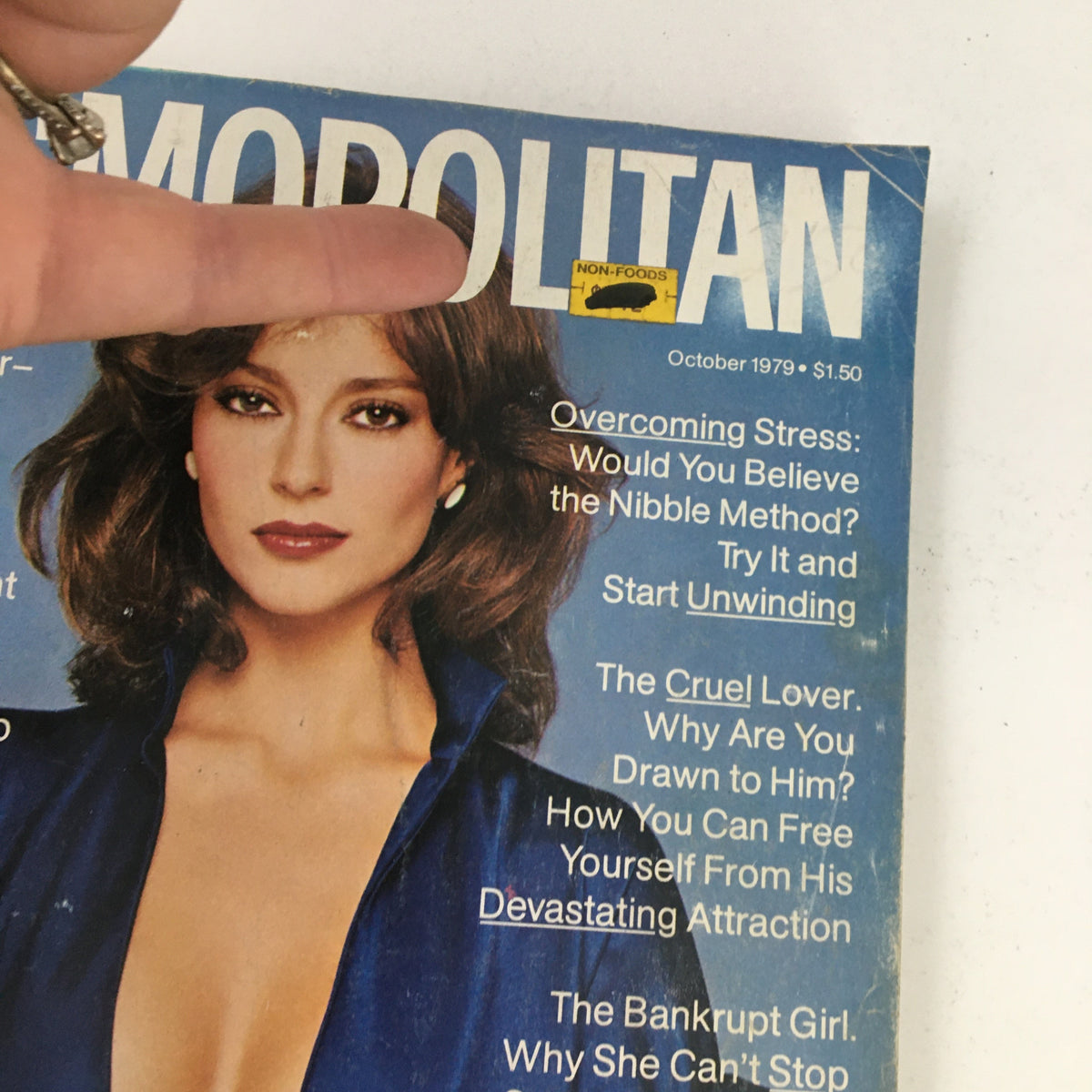 Close-up view of the cover of Cosmopolitan Magazine October 1979 highlighting key topics such as overcoming stress and personal development.