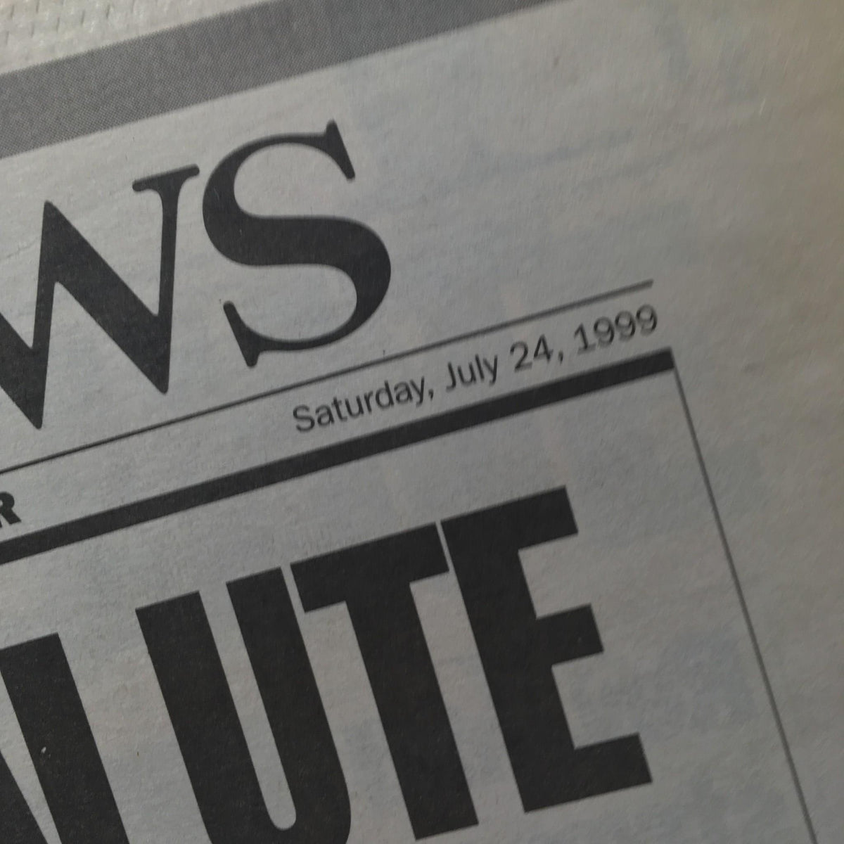 Close-up of the NY Daily News date stamp, Saturday, July 24, 1999, highlighting the publication of the special edition honoring John and Carolyn Kennedy.