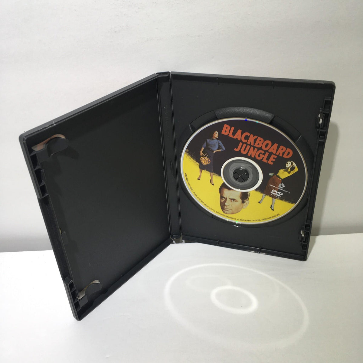 Open DVD case featuring the disc for 'Blackboard Jungle 2005 Glenn Ford DVD' showcasing the film's title and related artwork.