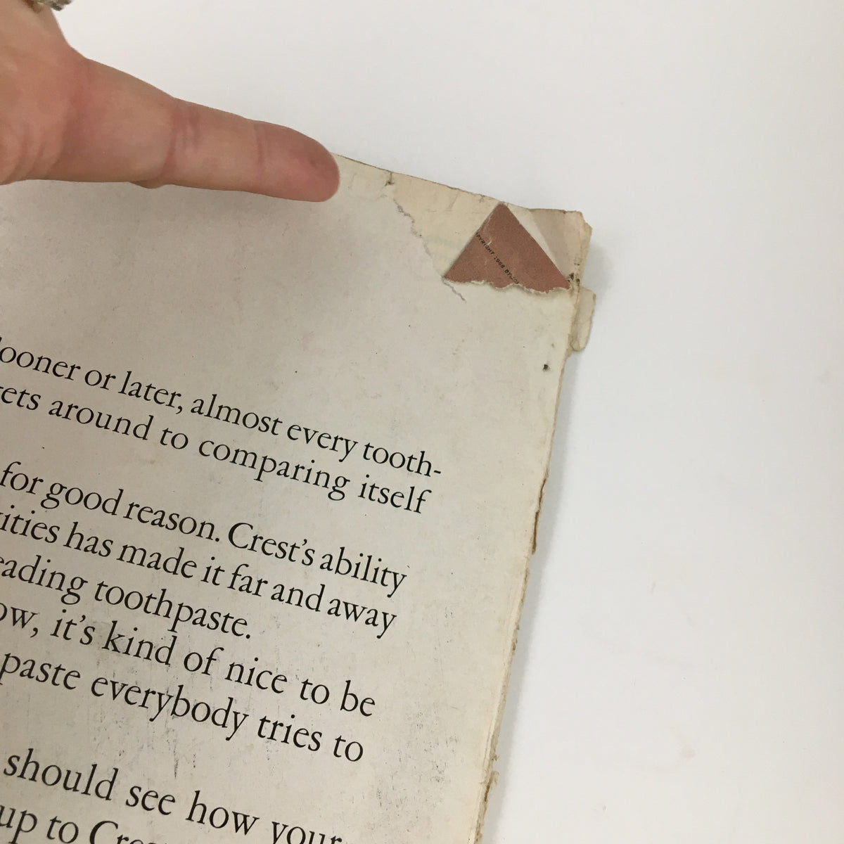 Back cover of Ladies' Home Journal Magazine January 1969 showing wear and tear, with text about toothpaste, reflecting its historical significance.