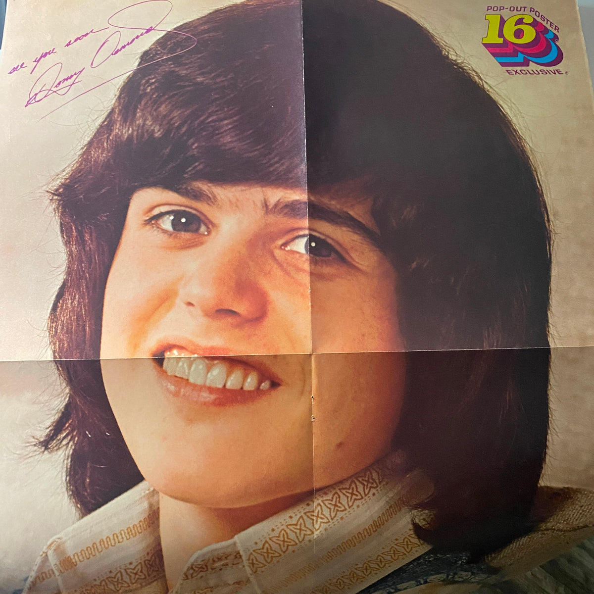 Signed pop-out poster from February 1974 16 Magazine featuring a smiling Danny. A collectible piece for fans.