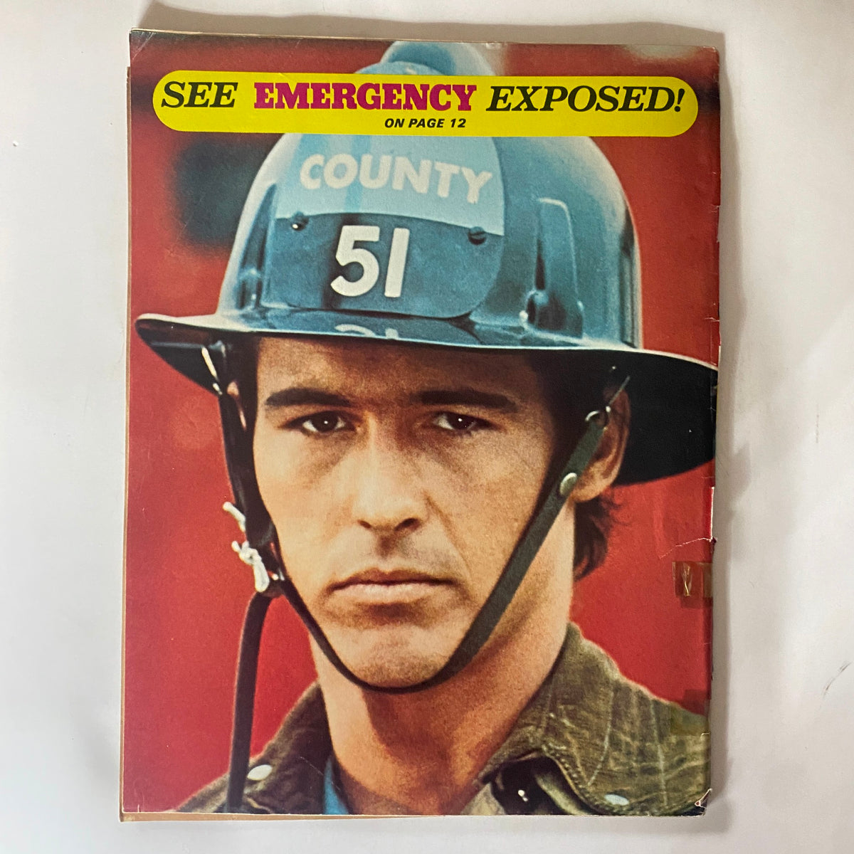 Cover image of February 1974 16 Magazine showcasing a firefighter, with the headline 'SEE EMERGENCY EXPOSED!'