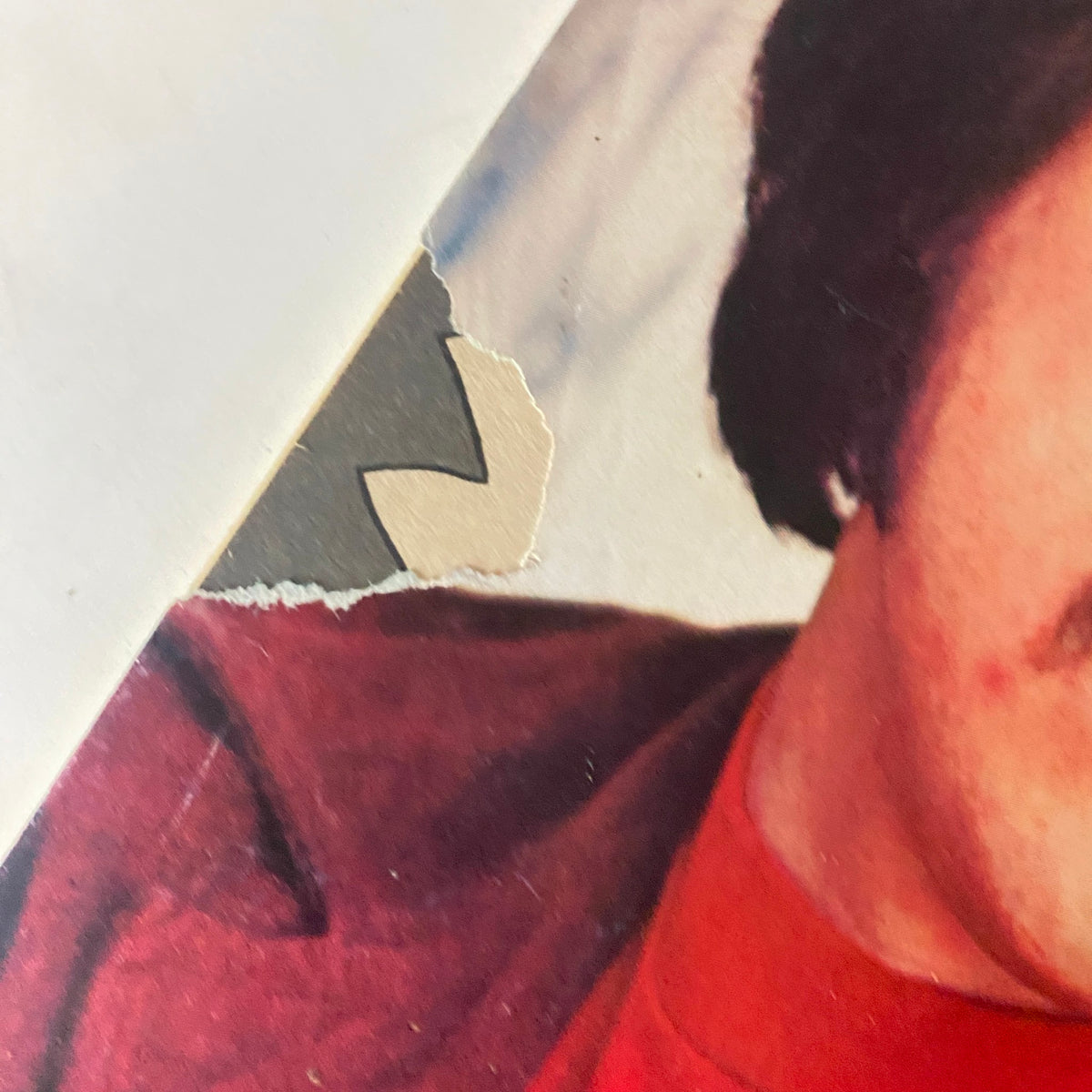 Detail image of the cover of VTG SPEC Magazine February 1975 showing a torn corner, featuring Freddie 'Chico' Prinze in a stylish outfit, indicative of 1970s fashion.