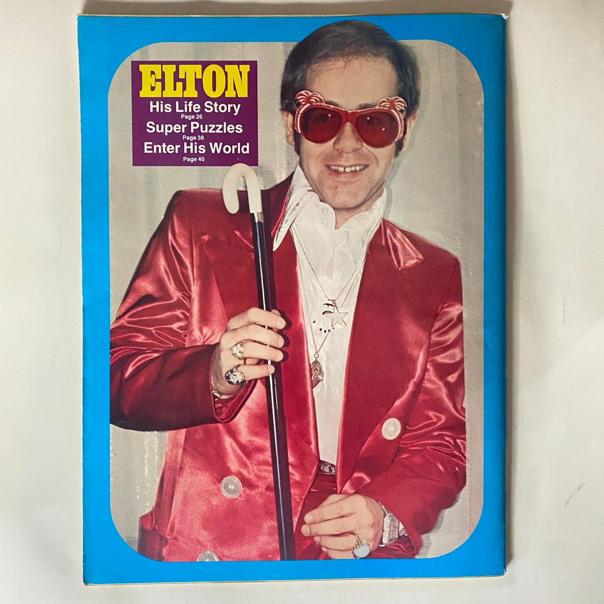 VTG 16 Magazine May 1976 featuring an iconic image of Elton John in a red suit and oversized sunglasses, showcasing a vintage pop culture collectible.