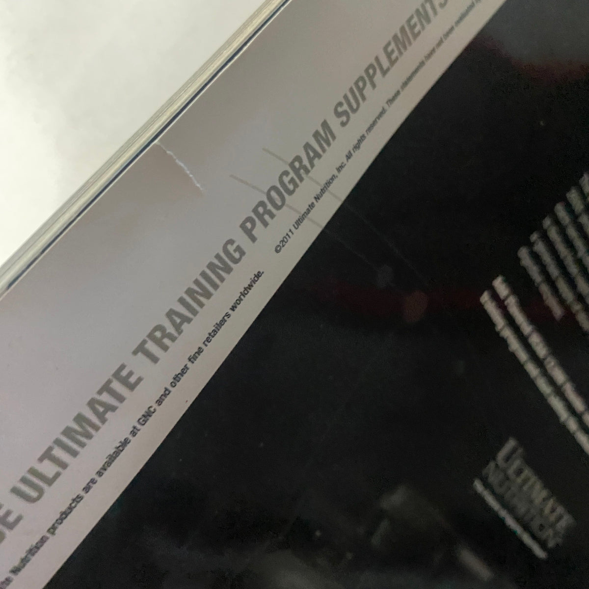 Close-up view of the back cover of Train Hard-Fight Easy Magazine January 2012, highlighting promotional details for training supplements.