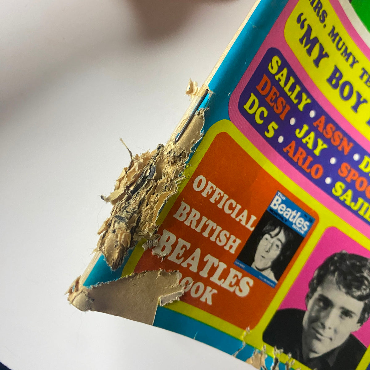 Close-up of the damaged corner of Teen Datebook Magazine September 1968, showing wear and tear but retaining the colorful cover design featuring Davy Jones and Beatles-related content.