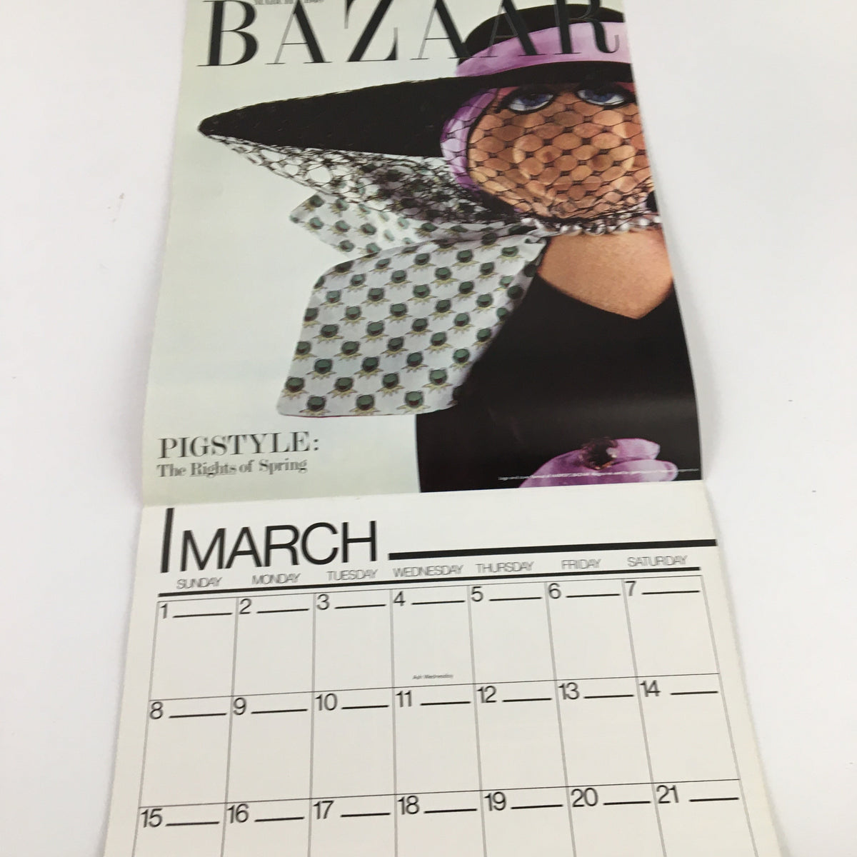 Jim Henson's Muppets Present The Miss Piggy Cover Girl Fantasy Calendar 1981. Calendar page for March showcasing Miss Piggy in a stylish hat, highlighted in a Bazaar setting.