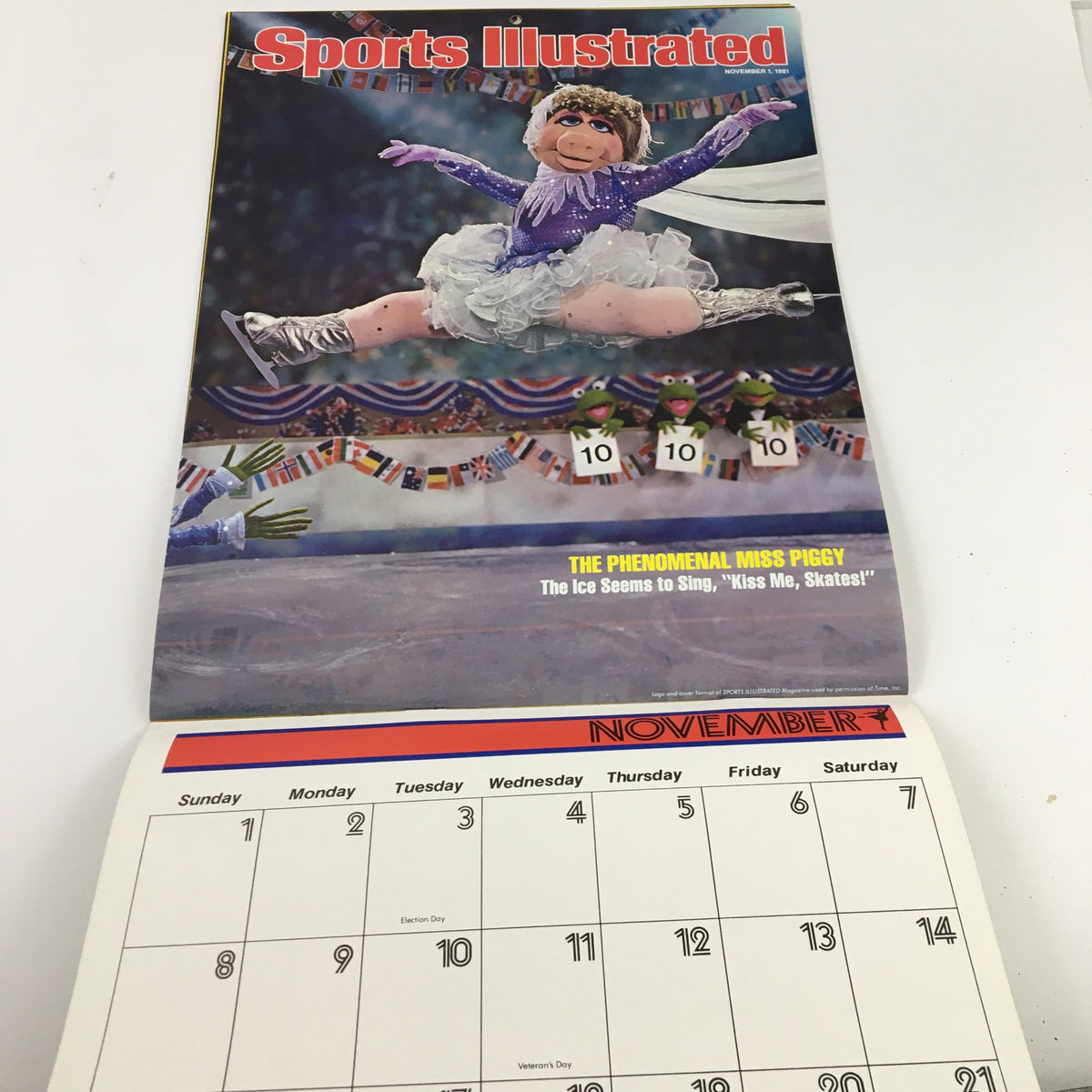 Jim Henson's Muppets Present The Miss Piggy Cover Girl Fantasy Calendar 1981, showcasing a magazine cover of Miss Piggy gliding on ice, dressed in a sparkling outfit with Kermits holding scorecards, for November.