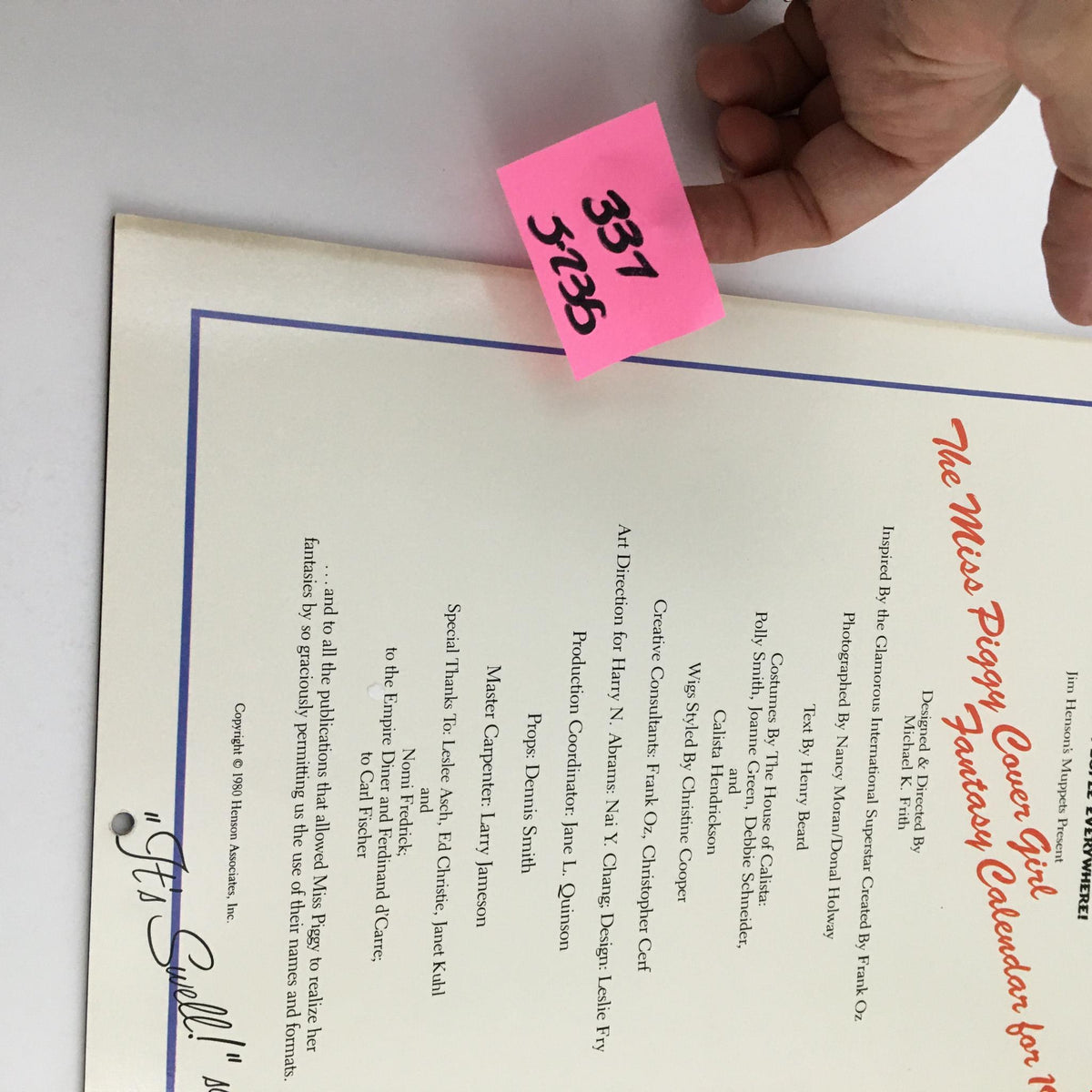 Jim Henson's Muppets Present The Miss Piggy Cover Girl Fantasy Calendar 1981, showing a close-up of the calendar's back page with production notes and a handwritten note, emphasizing its collectible nature.
