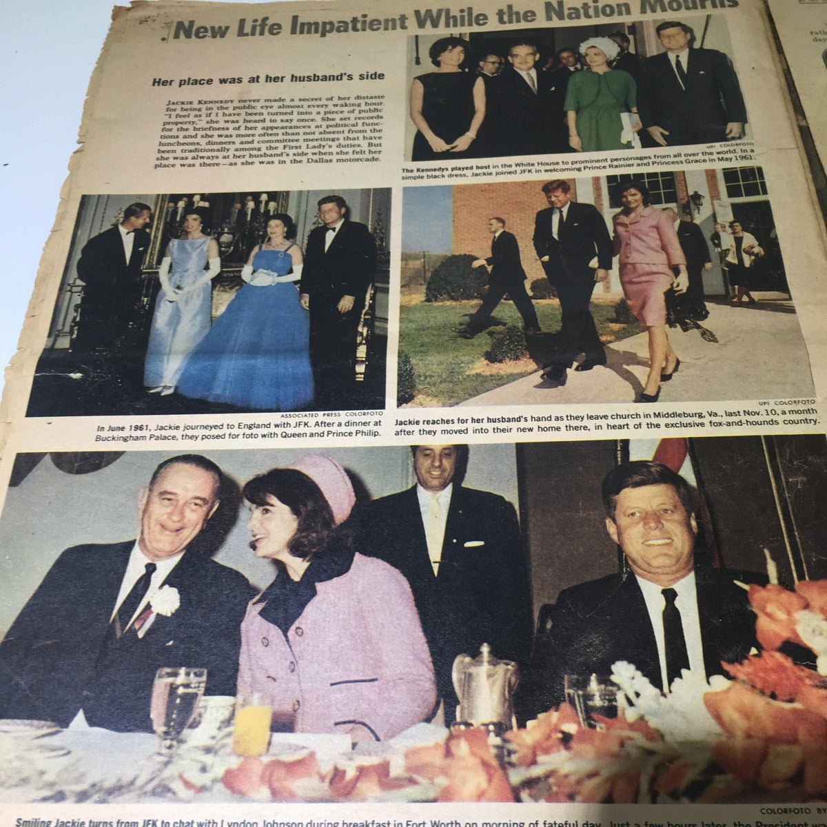 Vintage NY Daily News from November 26, 1963 featuring the JFK funeral coverage. The page includes images of Jackie Kennedy with prominent figures and the somber procession honoring President Kennedy.