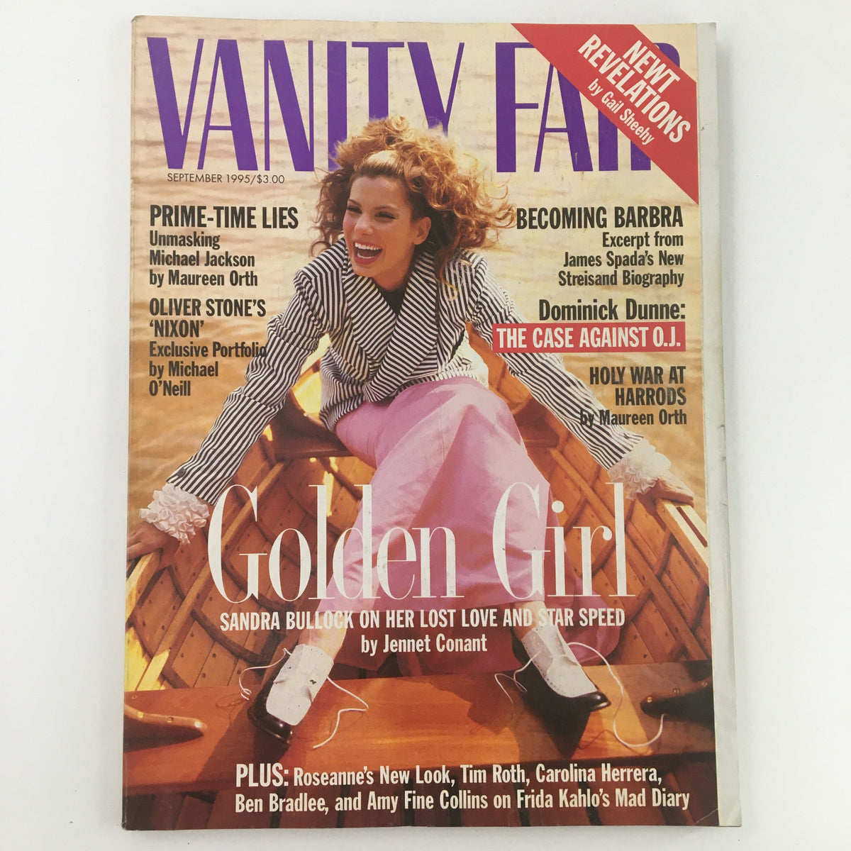 Vanity Fair Magazine September 1995 cover featuring Sandra Bullock in stylish attire, labeled 'Golden Girl', showcasing articles on Hollywood and pop culture of the 90s.