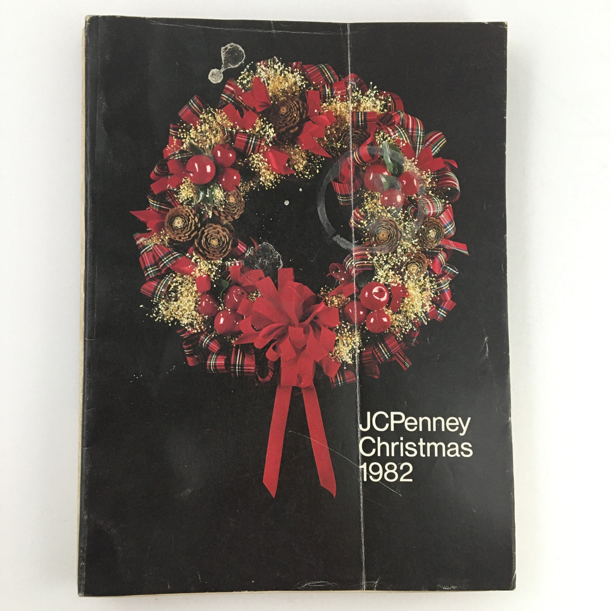 Cover of the 1982 JCPenney Christmas Toys and Strawberry Shortcake Price Guide Catalog, featuring a festive wreath design.