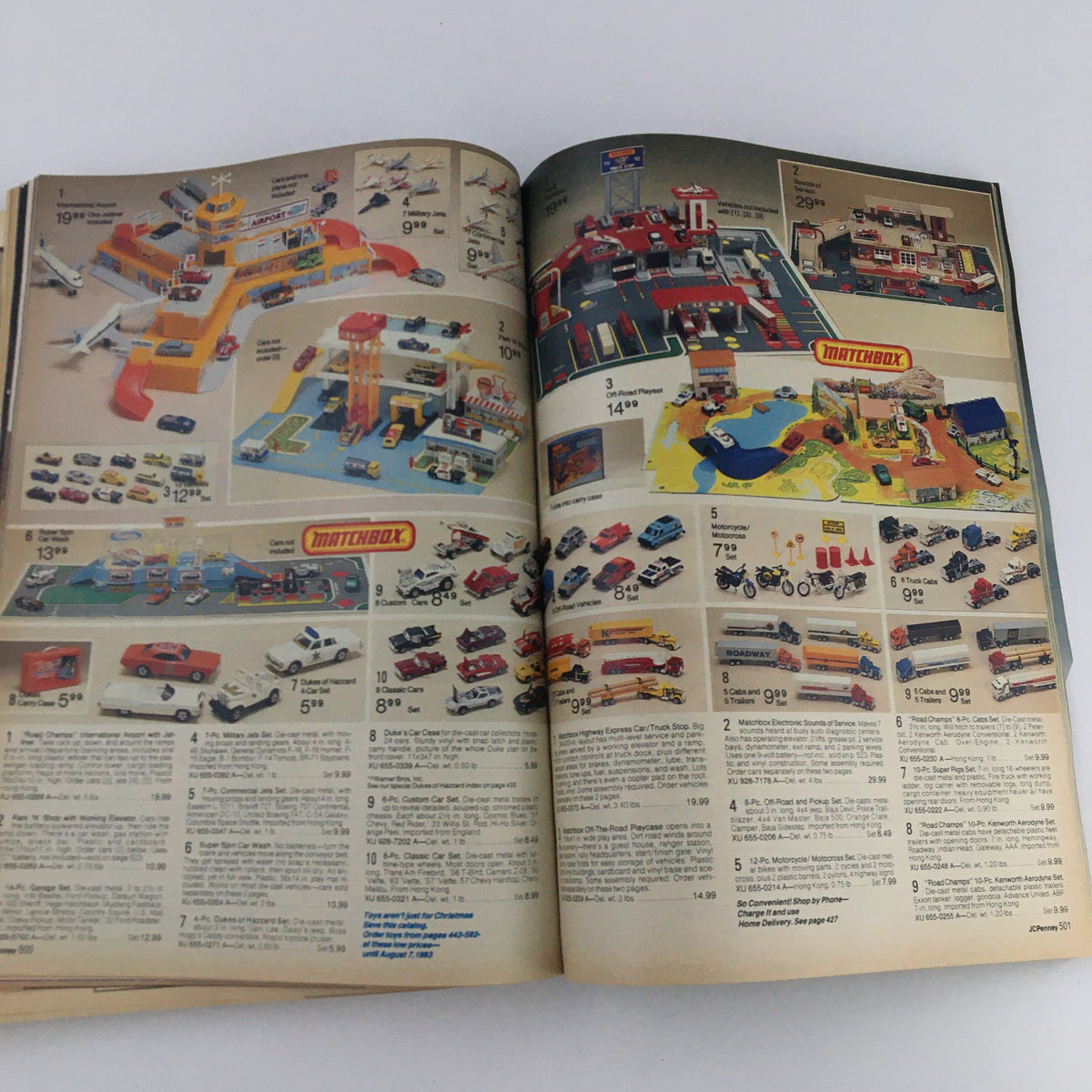 1982 JCPenney Christmas Toys and Strawberry Shortcake Price Guide Catalog page showcasing Matchbox cars and playsets with various vehicle toys.