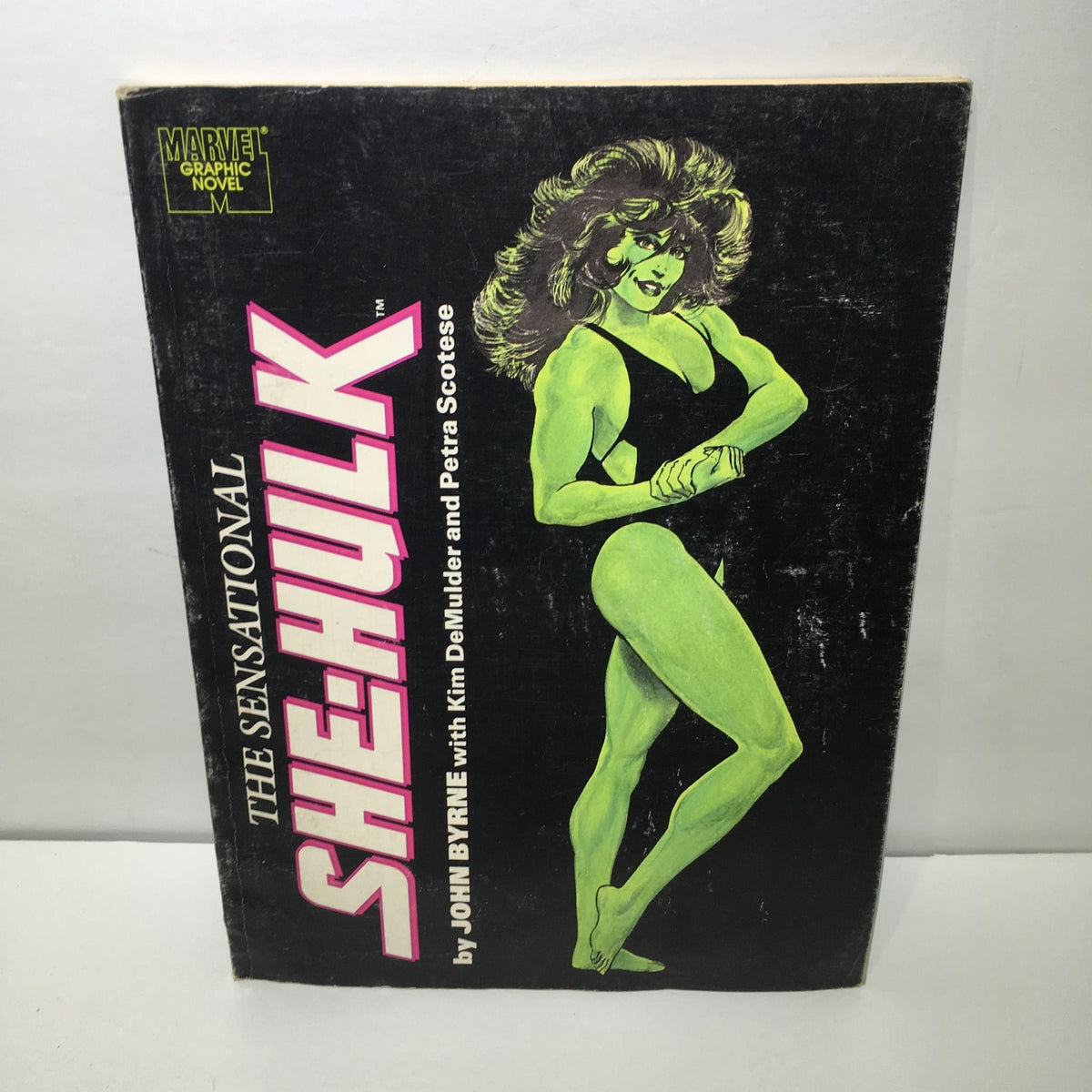 Cover image of Stan Lee Presents: The Sensational She-Hulk Magazine showcasing the titular character in a green hue, illustrated by John Byrne, featuring bold lettering in pink.