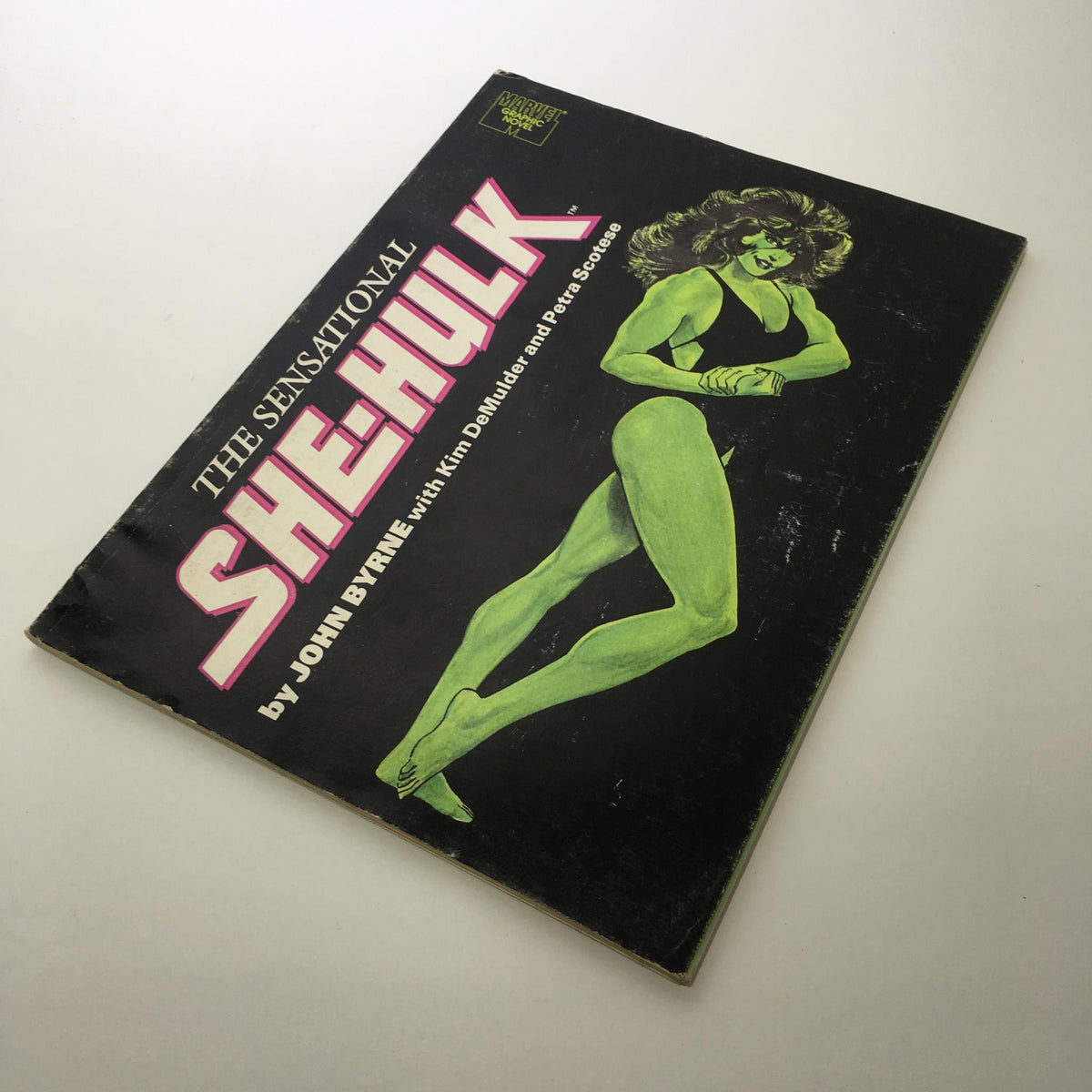Cover of 'Stan Lee Presents: The Sensational She-Hulk,' featuring a bold illustration of She-Hulk with striking colors and typography.