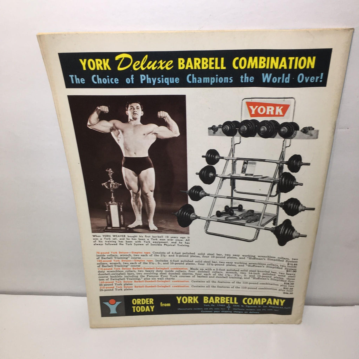 Advertisement for York Deluxe Barbell Combination from the back of the Muscular Development August 1972 issue, promoting weightlifting equipment for physique champions.