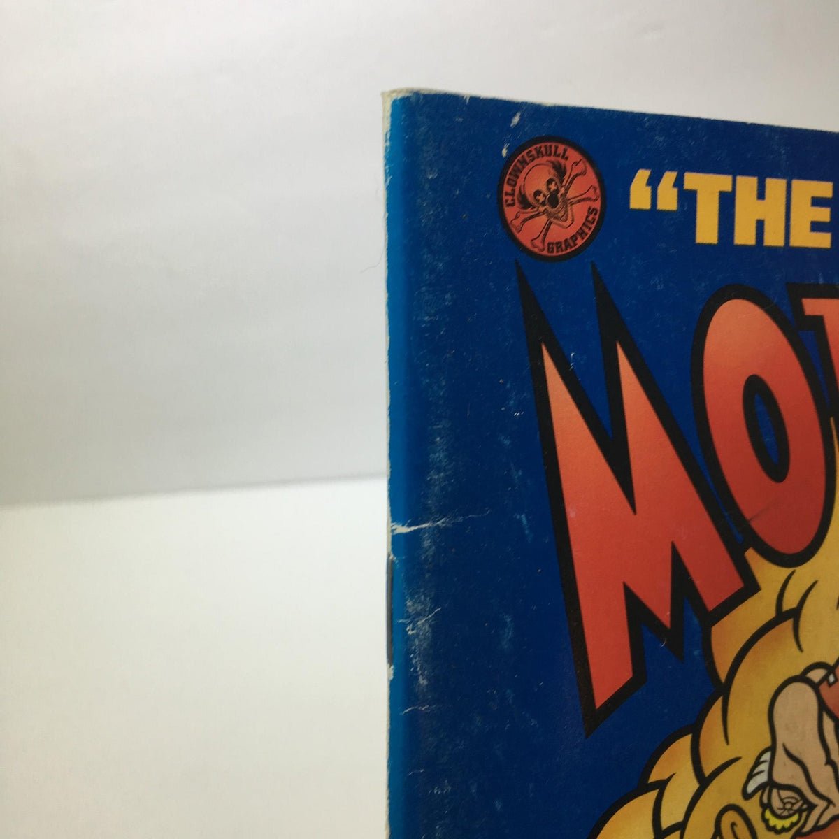 Corner detail of MotorBooty Music Magazine 'High Time for Hooey', showing slight wear on the edge, emphasizing its vintage charm.