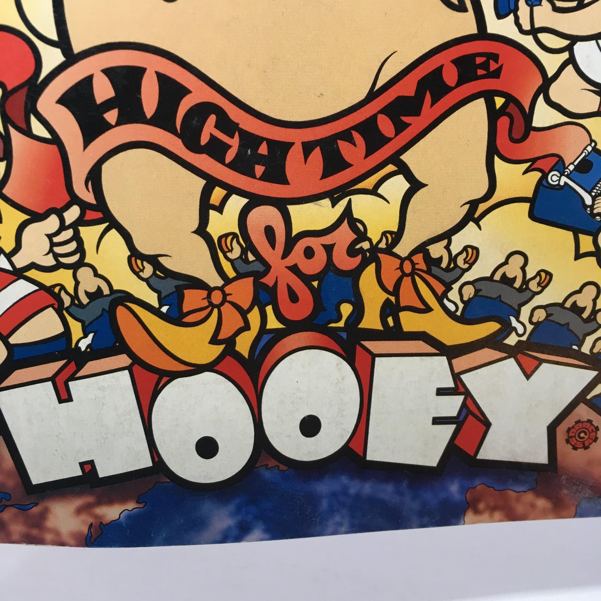 Cover of MotorBooty Music Magazine titled 'High Time for Hooey' featuring colorful cartoon characters and stylized lettering.