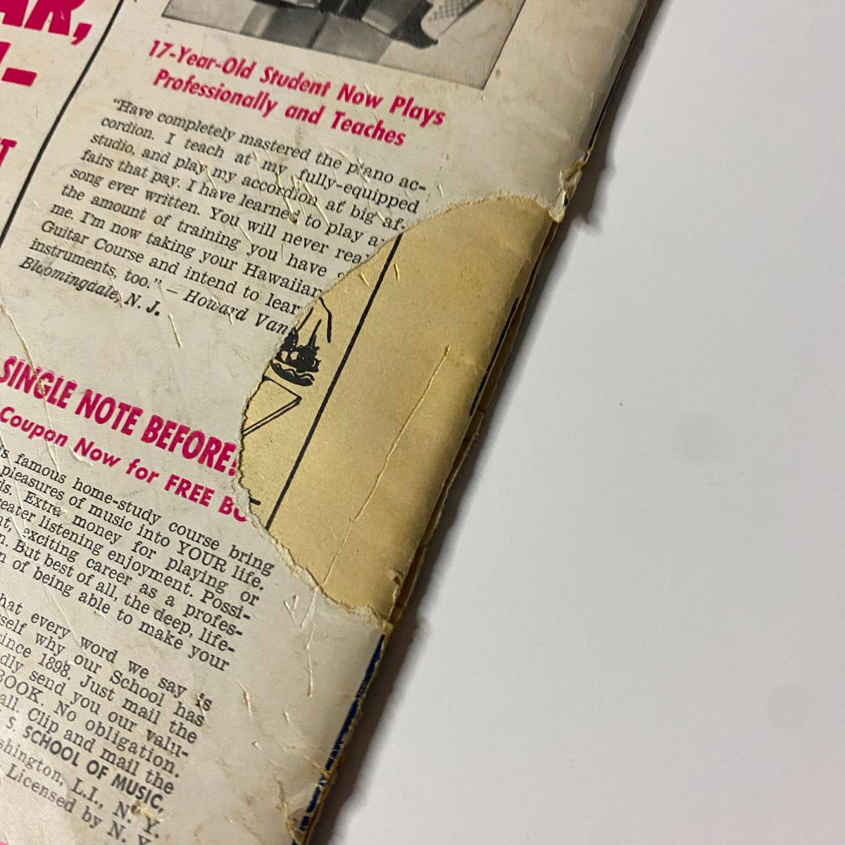 Detail of the back cover of Hit Parader Magazine May 1964 featuring The Beatles and Hayley Mills, showing some wear and a discolored area.