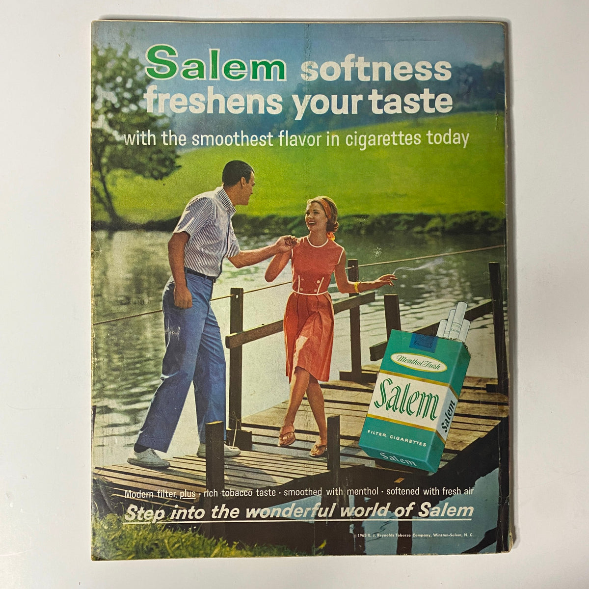 Vintage advertisement for Salem cigarettes from Modern Screen Magazine, highlighting a couple beside a lake, promoting the smooth flavor of Salem cigarettes with a nostalgic design.