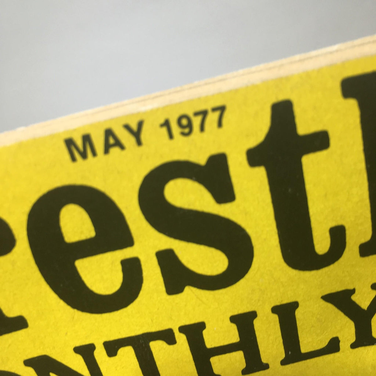 Close-up of the top header of Wrestling Monthly Magazine May 1977 detailing the month and year prominently shown.