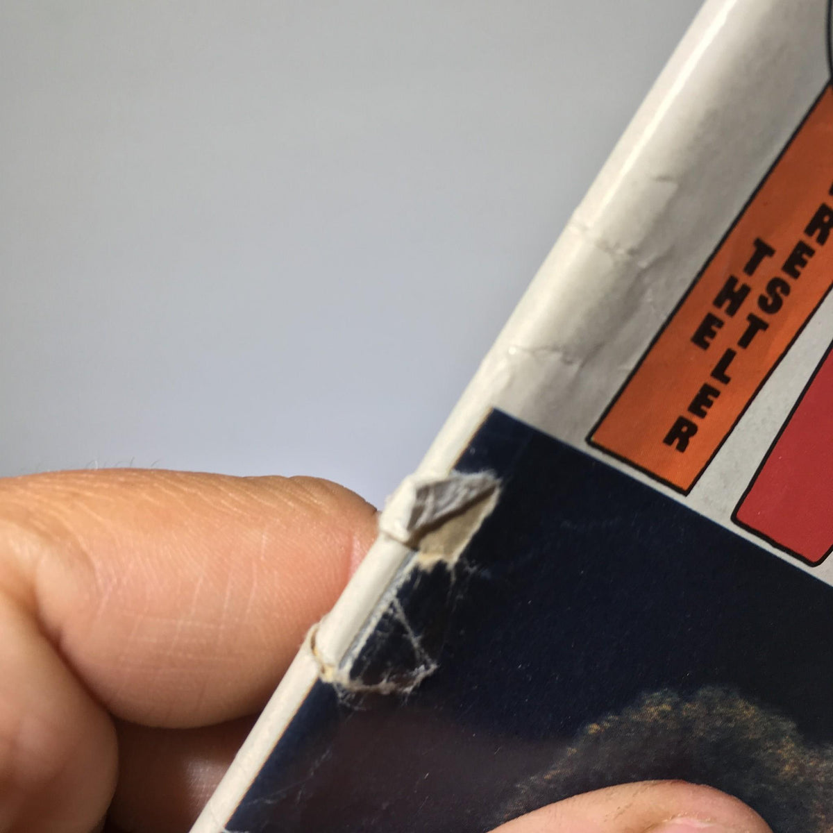 Close-up view of the spine of The Wrestler Magazine July 1976, showing minor wear and a small rip. This magazine features Andre the Giant & Ivan Putski.